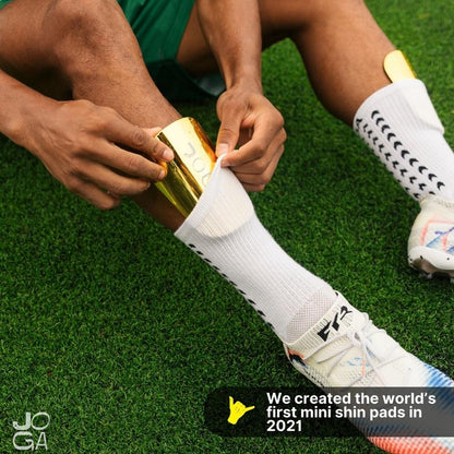 Paquete de mini toallas sanitarias doradas